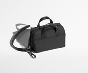 The Micro Everywhere Bag with a strap that attaches to any bag or suitcase