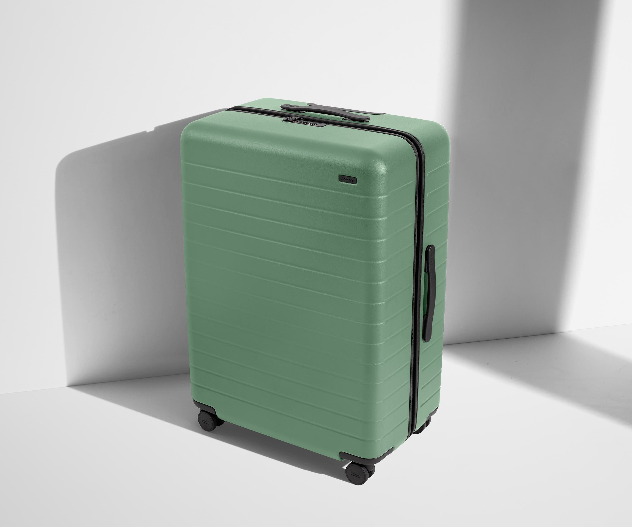 Angled product view of The Large suitcase in Sea Green