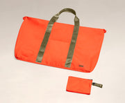 Packable Carryall laying flat and shown with the compact zip pouch to store when not in use