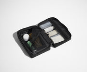 Small Toiletry Bag packed with a comb, skincare, and other travel-sized toiletries