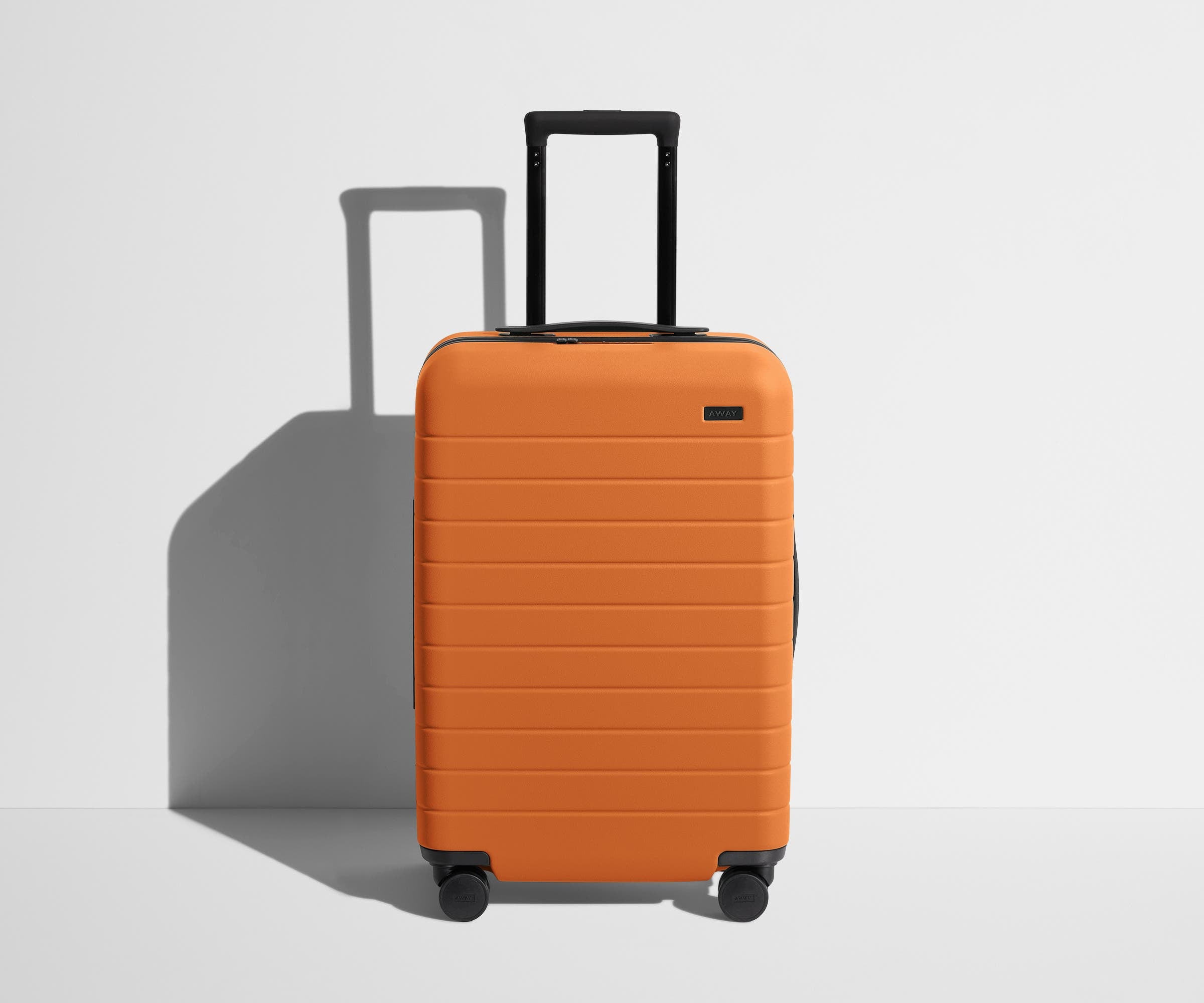Shop The Bigger Carry-On suitcase in Sorbet Orange | Away