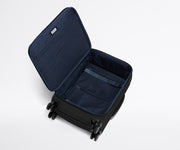 Open, unpacked Softside Bigger Carry-On, showing the depth of the bag and signature compression pad feature