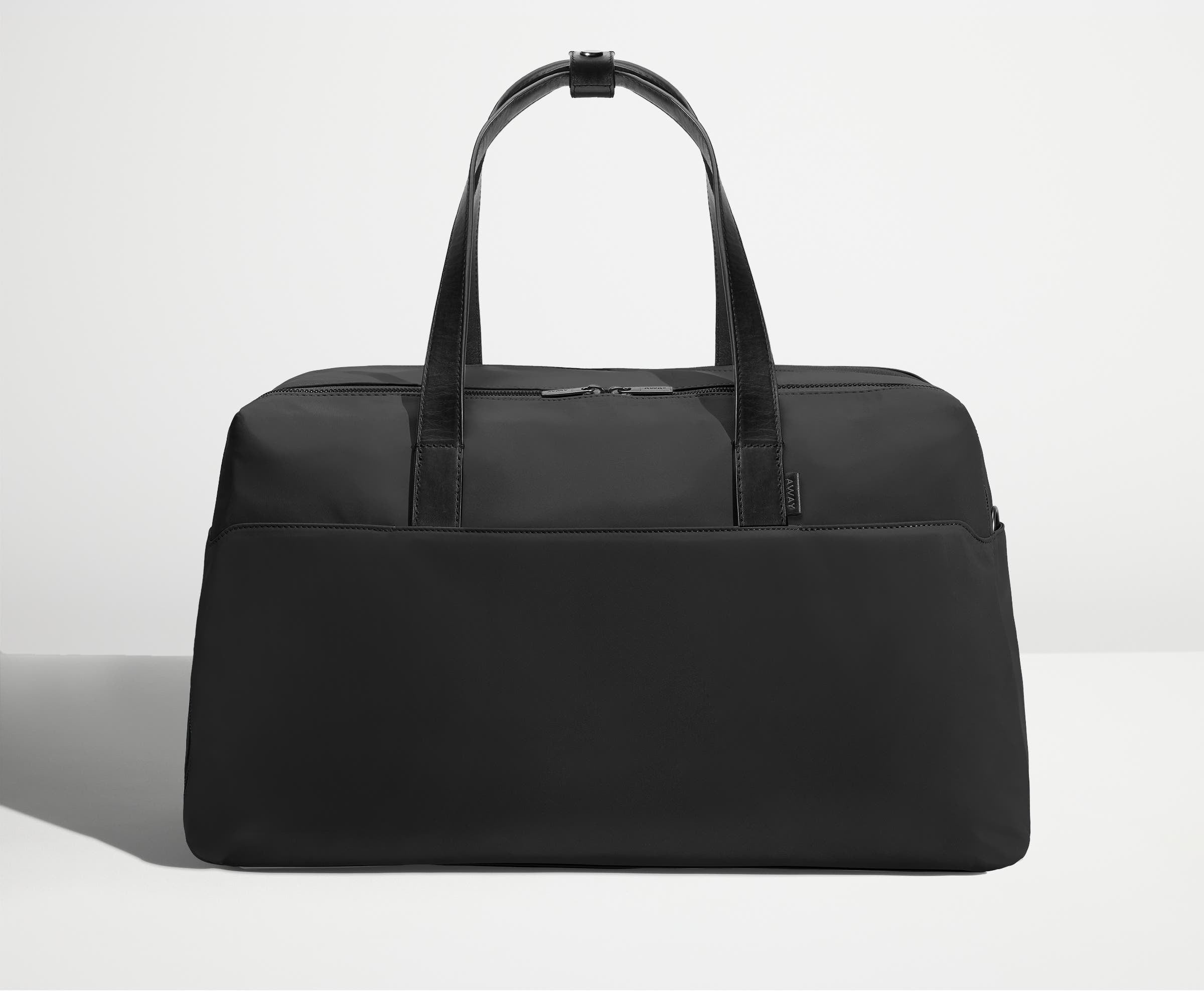 Front view of Away's Weekender duffle in Jet Black with handles up