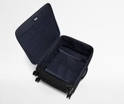 Open, unpacked Softside Large suitcase, showing the depth of the bag and signature compression pad feature