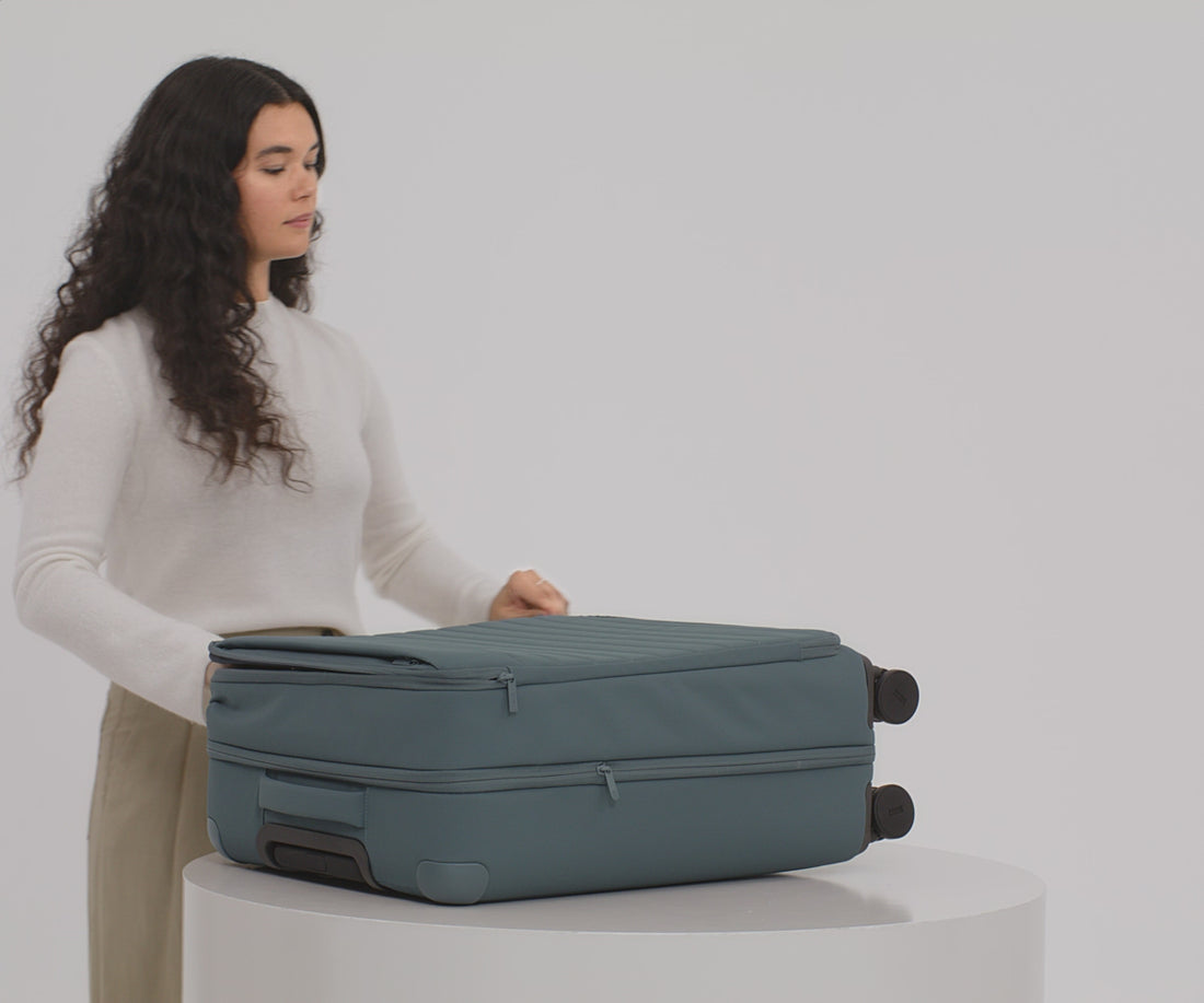 Video of a person packing their Softside Medium suitcase