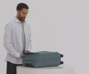 Video of a person packing their Softside Bigger Carry-On suitcase